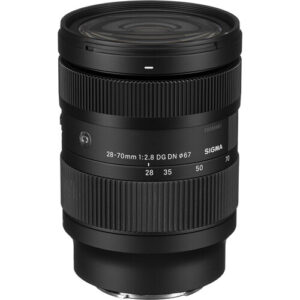 The 28-70mm f/2.8 DG DN Contemporary Lens for Sony E-Mount from Sigma is a versatile wide-angle to portrait-length zoom characterized by its f/2.8 constant maximum aperture. The design suits working in available lighting conditions while affording increased control over depth of field. More lightweight and compact than similar 24-70mm lenses, it's optical design incorporates two FLD and two SLD low-dispersion elements plus three aspherical elements that reduce a variety of aberrations to achieve high sharpness, enhanced clarity, and improved color accuracy. It features just one lightweight focusing element, which keeps the AF unit small. This, along with a quiet and fast stepping motor, makes for responsive and near-silent autofocus performance, an ideal combination for filmmakers looking for a high-performance, lightweight, and easy-to-handle camera system that works well with a gimbal or other accessories. Each optical surface features Super Multi-Layer and Nano Porous coatings to improve contrast and color rendering by suppressing lens flare and ghosting for optimal light transmission, and an added water- and oil-repellent coating on the front optic helps keep the lens free from smudges and droplets. The weather-sealed design benefits working in trying environmental conditions, and a nine-blade rounded diaphragm contributes a pleasing bokeh quality when using wider apertures. Standard zoom for full-frame E-mount mirrorless cameras 42-105mm equivalent focal length when used on an APS-C camera Constant f/2.8 maximum aperture for Low light use and depth-of-field control Two F Low Dispersion (FLD) and two Special Low Dispersion (SLD) elements reduce chromatic aberrations and color fringing Three aspherical elements control spherical aberrations and distortion Both Super Multi-Layer and Nano Porous coatings minimize lens flare and ghosting and produce contrast-rich and color-neutral imagery Integrated stepping motor and optimized AF algorithm provides quick and quiet autofocus 28mm minimum focus distance: 7.5", 1:3.3 magnification 70mm minimum focus distance: 15", 1:4.6 magnification Rounded nine-blade diaphragm for a pleasing bokeh quality Brass bayonet for mounting accuracy and rigidity Rubber sealing for dust- and splash-resistance