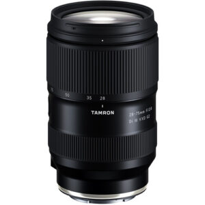 Featuring an updated optical design and refined focusing system, the Tamron 28-75mm f/2.8 Di III VXD G2 is a Sony E-mount zoom offering a versatile wide-to-portrait-length range and bright f/2.8 maximum aperture. Revamped optics yield higher resolution and improved sharpness over the previous generation and the focusing system has been replaced with a VXD (Voice-coil eXtreme-torque Drive) mechanism that achieves faster, more precise performance to suit both stills and video applications. As the second generation of this popular lens, this updated version also sees refinements to the exterior design of the lens, a closer minimum focusing distance of 7.1", and a new connector port for streamlining the process of working with Tamron Lens Utility software to adjust lens settings. Versatile standard zoom designed for full-frame Sony E-mount mirrorless cameras but can also be used with APS-C models where it will provide a 42-112.5mm equivalent focal length range. Bright constant f/2.8 maximum aperture affords consistent illumination throughout the zoom range and also affords greater control over depth of field for working with selective focus techniques. Improved optical design increases resolution and enhances imaging performance. VXD (Voice-coil eXtreme-torque Drive) linear motor focus mechanism provides fast, quiet, and precise autofocus performance throughout the zoom range. Minimum focusing distance of just 7.1" and a 1:2.7 maximum magnification for working with close-up subjects. Updated ergonomic design for improved operability. Connector port works in conjunction with Tamron Lens Utility software for customizing lens functions and updating firmware through the lens rather than through the camera.
